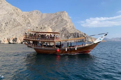 Full day khasab dhow cruise: swim, snorkel, dolphin watch, visit telegraph & seebi islands. includes omani buffet lunch, tea, gear & village views.