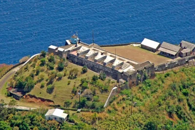 Explore pirates of the caribbean film set, dark view falls, and buccament bay on a guided st. vincent tour with local rum punch and scenic stops.