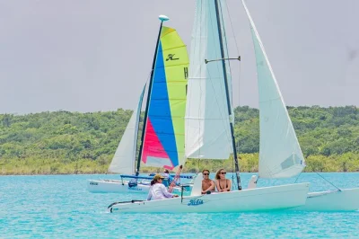 Let bacalar’s quiet waters surprise you—private sailing, birdwatching, swimming in crystal-clear cenotes, and fresh fruit with a local captain. includes pickup.