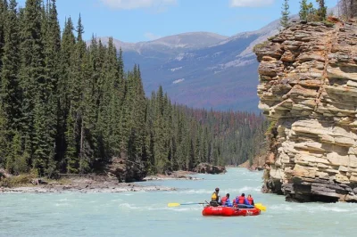 Feel the rush of athabasca canyon’s class ii rapids near jasper, paddle with expert guides, spot wildlife, and enjoy family-friendly rafting with all gear included.