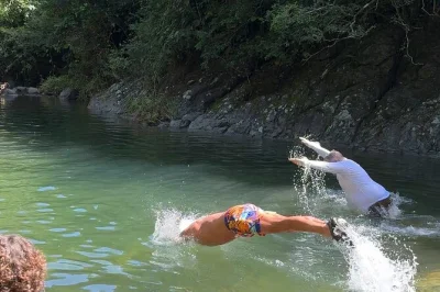 Feel the quiet of don chencho waterfalls on a small group day trip from san juan, with forest trails, natural swimming pool, bakery stop, and local lunch included.