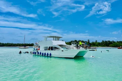 Private punta cana catamaran cruise with snorkeling, open bar, music, and a stop at the natural pool. includes snacks, drinks, and hotel pickup for easy booking.