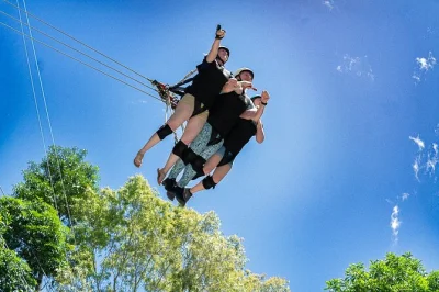 Feel your heart race on the giant swing at skypark cairns, soaring above rainforest with great barrier reef views. includes photo & video package plus easy pickup.
