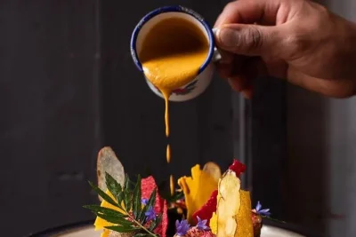 Start with a three-course bolivian lunch, ride the la paz cable car to el alto, walk jaén street & the witches’ market, and sip high-altitude coffee—all with a local guide.