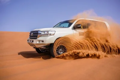 Feel the thrill of dubai’s desert safari with dune bashing, sandboarding, camel rides, live shows & bbq dinner. includes hotel pickup by 4x4 for a full evening escape.
