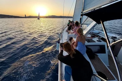 Feel the barcelona breeze on a sunset sailing cruise from port olímpic, with skyline views, open bar, snacks, and a local skipper guiding you along the coast.