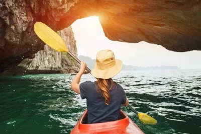 Feel the salt air on a halong bay day trip from hanoi with a small group, kayaking, surprise cave, titop island swim, and vietnamese lunch. includes hotel pickup.