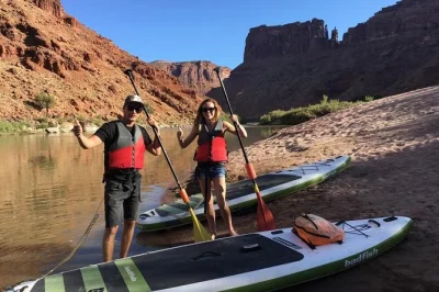 Float past arches’ red rocks on a calm colorado river sup tour from moab. includes pickup, snacks, and a guide who makes paddling feel easy—even for first-timers.