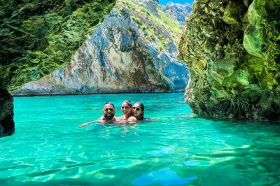 Swim through karaburun’s blue cave, snorkel wild bays, and hike above grama bay—includes boat, guide, snacks, and all fees for a full day of albanian coastline adventure.