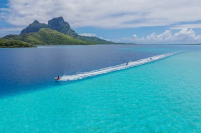 Feel the spray as you circle bora bora by jet ski, stop for a swim on a sandbank, and taste fresh fruit on a motu. includes guide and flexible departures.