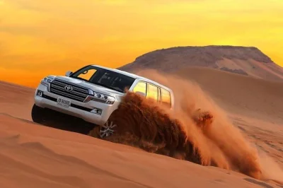 Feel the dubai desert with dune bashing, camel rides, sandboarding, and a bbq dinner under the stars. includes pickup, local guide, and traditional activities.