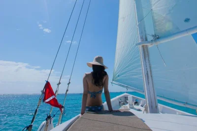 Feel the breeze off ambergris caye as you sail at sunset on the sirena azul, with light refreshments, a local guide, and easy group booking included.