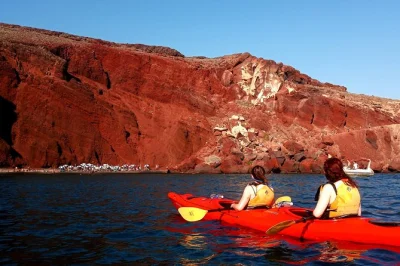 Feel the volcanic coast of santorini by sea kayak, explore red & white beach, swim in hidden coves, and share a greek taverna lunch. includes hotel pickup.