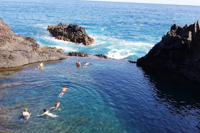 Feel the atlantic spray at porto moniz lava pools, wander fanal’s misty forest, and stand on cabo girão’s glass skywalk. includes pickup from funchal.