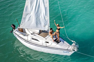 Feel the colors of bacalar's lagoon, sail to cenotes, and hear local stories with a guide. includes swimming stops and bottled water for your day.