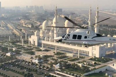 See abu dhabi from above on a private helicopter tour. fly over the grand mosque, emirates palace, corniche, and yas island. book your aerial adventure today!