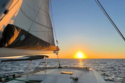 Feel the calm of turks & caicos on a private catamaran sunset cruise to pine cay and grace bay beach, with drinks, snacks, and a relaxed local crew included.