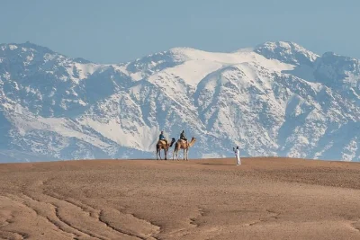 Experience a full-day agafay desert camel ride and ourika valley tour from marrakech. includes atlas mountains, berber villages, and local mint tea.