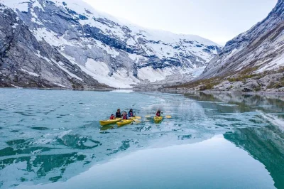 Start with a kayak across nigardsbreen’s blue lake, then hike with a local guide on the glacier—gear included. small groups, pickup point at breheimsenteret.