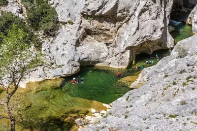 Feel the rush of canyoning in galamus gorge with a friendly guide, optional jumps, and turquoise pools. includes all gear. perfect for families or first-timers.