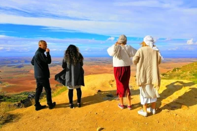 Experience a day trip from marrakech to the atlas mountains, 4 valleys, berber villages, camel ride, waterfalls & local tea. includes guide & transport.