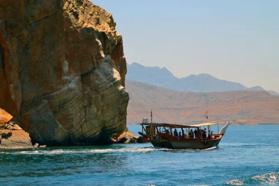 Full-day khasab dhow cruise with dolphin watching, snorkeling at telegraph island, lunch onboard, and pickup from cruise terminal. book your musandam fjord adventure.