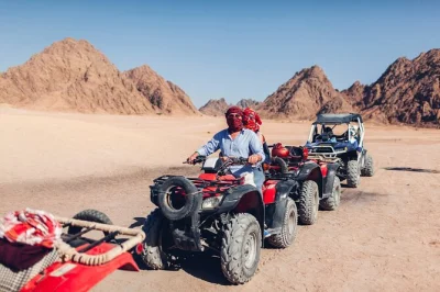 Feel the sinai desert come alive on a quad biking and camel ride tour from sharm el sheikh, with bedouin bbq dinner, live shows, and hotel pickup included.