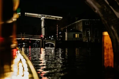 Float through amsterdam’s glowing canals at night, sip local wine or craft beer, and share dutch cheese on a small-group boat with a friendly host. includes drinks & cheese board.