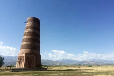 Explore burana tower and issyk-kul’s cholpon-ata in one day. includes hotel pickup, guide, petroglyphs, nomad games stadium, and lakeside views.