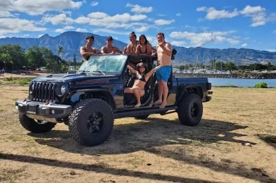Private oahu north shore jeep tour with guaranteed turtle sightings, surf lesson, glass-bottom kayak, paddleboard, and famous shrimp truck lunch.