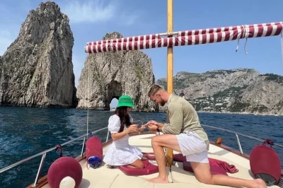 Feel the sea breeze on a capri private boat tour for couples, swim at the green grotto, cruise past faraglioni, and relax with a local sailor—includes drinks & snorkel gear.