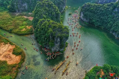 Curious about ninh binh? climb hang mua, cycle tam coc rice fields, and boat through trang an caves—all in one private day trip from hanoi with lunch included.