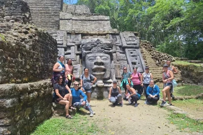 Feel the jungle come alive at lamanai mayan ruins in belize, with a river cruise, ancient temples, and a local lunch. includes pickup, boat ride, and guide.
