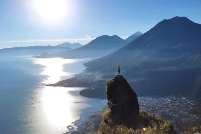 Wake up early for a sunrise hike on indian’s nose above lake atitlan, with panoramic volcano views, coffee at the summit, and small group transport included.