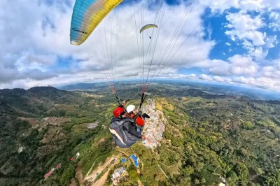 Fly tandem paragliding in buenavista, quindío. certified pilots, safety gear, photos & video included. soar above colombia’s coffee landscape—book now!