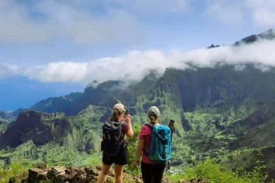 Feel the volcanic earth beneath your boots on santo antão’s cova de paúl crater hike, wander through green valleys, and taste local grogue with a guide—includes pickup.