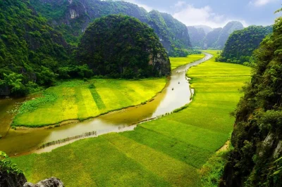 Feel the quiet of ninh binh’s rivers, cycle past rice fields, and share a meal with locals on this private day trip from hanoi. includes hotel pickup & lunch.