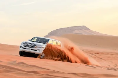 Feel the rush of dune bashing in dubai’s lehbab desert, try a camel ride, and enjoy live music and a buffet dinner. includes hotel pickup and small group size.