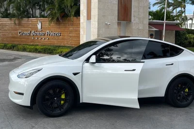 Book a private tesla transfer from sdq airport to santo domingo. eco-friendly, fast, and comfortable ride with wifi, water, and ac included.