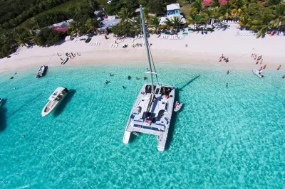 Wake up to a sail from st john to jost van dyke, snorkel coral reefs, sip painkillers at soggy dollar bar, and relax on white bay beach—includes breakfast and open bar.