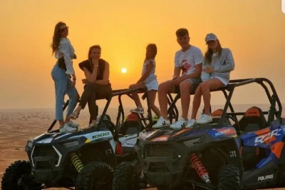 Feel the dubai desert come alive with a double-seated buggy ride, sandboarding, and camel riding—includes pickup and fresh coffee or tea to start your adventure.
