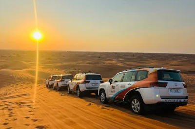 Feel the rush of dune bashing, taste a smoky bbq dinner under dubai’s desert sky, and watch live tanoura and fire shows. includes pickup and all activities.