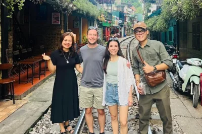 Hear the train thunder past in hanoi’s narrow streets, sip coffee with locals, and explore hoa lo prison, tran quoc pagoda, and more—includes pickup & guide.