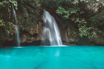 Hike osmeña peak, canyoneer badian, and swim at kawasan falls. private transport, local guide, and lunch included. book your cebu adventure today!