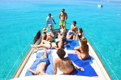 Feel the breeze on menorca’s south coast, swim at cala macarella, try paddle surf, and snack on board. includes drinks, snacks, and local guide from cala galdana.