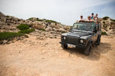 Feel menorca’s wild side on a private land rover tour—explore rural roads, ancient sites, and taste farm-fresh cheese with a local guide. includes pickup.