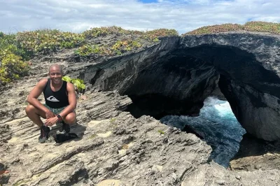 Feel the wild side of puerto rico—explore cueva del indio, taste mountain food in ciales, and swim at mar chiquita beach. includes pickup, lunch, local guide.