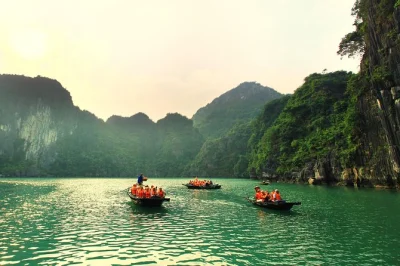 Wake up on halong bay with kayaking, cave walks, and floating village visits. includes all meals, transfers from hanoi, and a private cabin with local guide.