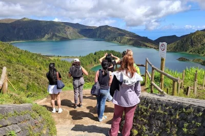 Feel the volcanic warmth of furnas, taste azorean pineapple and tea, stroll black sand beaches and relax in thermal springs—includes transport and local storyteller guide.