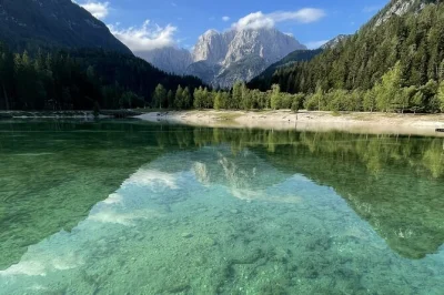 Feel the spray at peričnik waterfall, cross into italy for lake predil, and wind through soča valley on a small-group day trip from bled with pickup included.